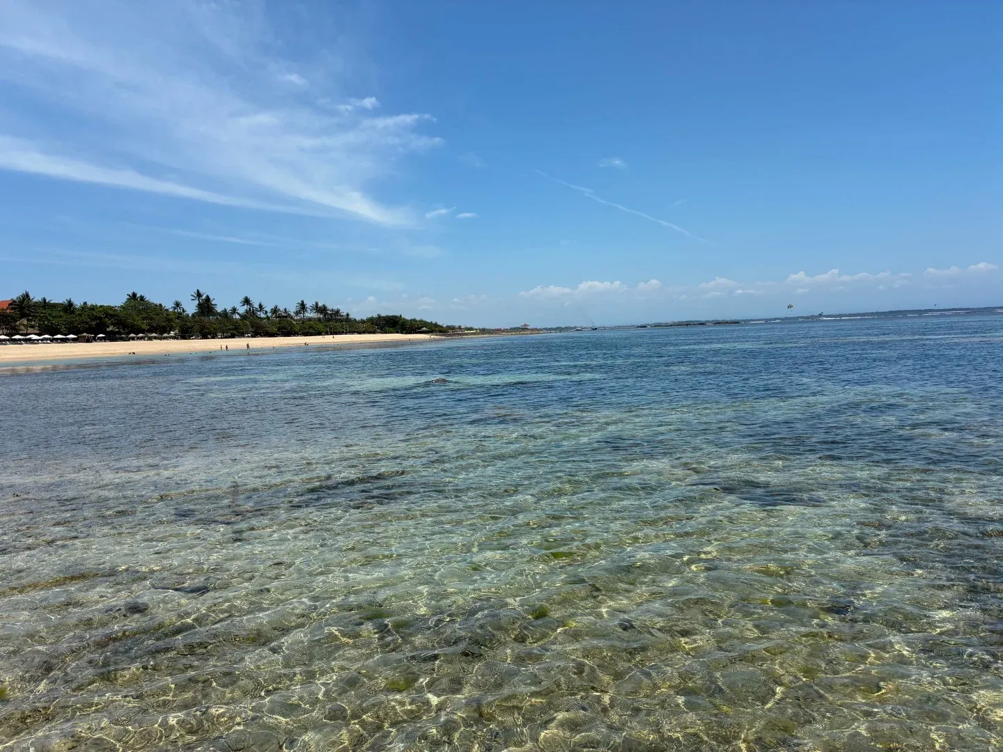 Clear, shallow water over the reef in front of the beach