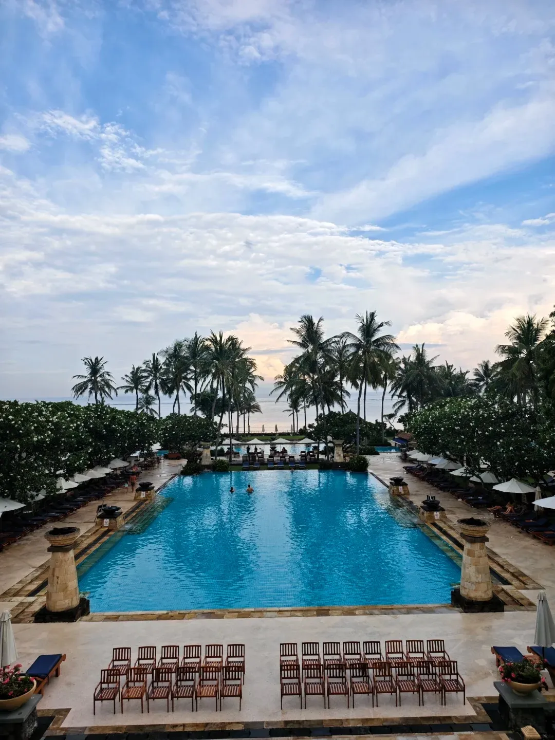 The long main pool stepping down towards the sea, seen from above